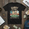 Funny t-shirt design with text "SORRY MY FERRET ATE MY HOMEWORK AND MY LUNCH MONEY TOO!" featuring a ferret on