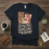 T-shirt with the quote "Sorry, this is a Date with my Book" featuring a bookshelf and armchair graphic