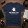 SORRY FOR BEING SO QUIET quote on a navy t-shirt with a minimalist hooded figure graphic