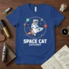Space Cat Explorer t-shirt design showing a cat in an astronaut suit riding a rocket through space with planets and