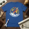 Blue t-shirt with "ИнТЕРКОСМОС" text, a red rocket, and a yellow globe graphic, evoking space exploration theme