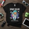 Space Selfie Cosmic Capybara Adventures t-shirt design showing a capybara in an astronaut suit taking a selfie with UFOs and