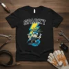 Sparky cartoon character holding wrenches in front of a lightning bolt on a black t-shirt