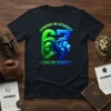 Spartan on Saturday Lion on Sunday text design with green spartan helmet and blue lion graphic on a black t-shirt