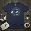 Speak ASMR To Me text design on a navy blue t-shirt, featuring concentric circles and small dots, perfect for ASMR