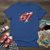 Blue t-shirt with bold red and yellow "67" graphic with motion lines and starbursts, representing retro racing speed