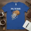 Spill the Beans t-shirt design featuring a cute cat peeking out of a bag of spilled coffee beans
