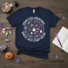 Navy t-shirt with "Spooky Cute Adventures Magical Loxot & Candy Dreams" in a circle, featuring Halloween icons like ghosts, pumpkins