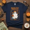 Spooky Cute Halloween 2024 t-shirt with a smiling ghost holding a pumpkin, surrounded by bats and pumpkins, featuring orange text