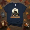 Spooky Cute Halloween t-shirt with three black cat pumpkins and a bat flying over a full moon