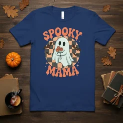 Spooky Mama t-shirt design with a cute ghost holding flowers, retro checkerboard background, and bats