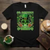 St. Patrick Vibes t-shirt design with a green skull wearing a top hat and sunglasses, making rock on hand gestures