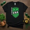 St. Patrick's Day USA t-shirt design with a green shield, shamrocks, and "USA" text