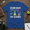 Stand Back Try Science t-shirt with colorful science graphics including beakers, magnets, and atoms