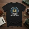 Stand and Speak Truth t-shirt with a silhouette of a person holding a torch on a mountain peak, surrounded by