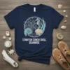 Navy t-shirt with circular design featuring starfish, conch shell, and seahorse. Text reads "STARFISH CONCH SHELL SEAHORSE"