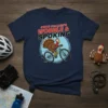 State College's Wobble & Spoking t-shirt with a cartoon turkey riding a bicycle, navy blue shirt