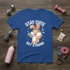 Stay Cute Get Strong text with a cartoon bunny lifting a dumbbell on a blue t-shirt