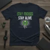 Stay Focused Stay Alive quote with target graphic and heartbeat line on a navy blue t-shirt