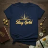 Stay Gold inspirational quote t-shirt with a golden compass design and a dark navy background