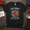 Black t-shirt with "Stay Sweet Fruit of the Spirit" text and a strawberry wreath graphic, listing virtues like love, joy