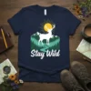 Stay Wild t-shirt with white deer, mountains, trees, river, and sun graphic