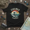 Stay Wild Ocean Child t-shirt with vintage wave and surfer graphic, retro sunset colors, beach theme