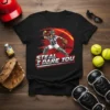 Black t-shirt with "STEAL I DARE YOU" text and a softball catcher graphic, ready to throw the ball