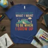 T-shirt with "Still Figuring Out What I Want To Be When I Grow Up" quote and whimsical city illustration