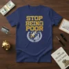 Navy blue t-shirt with yellow text "STOP BEING POOR" and a graphic of a rocket launching from a stock chart