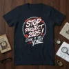 Bold white and red text saying "STOP PROJECT 2025! LOOK IT UP, Y'ALL!" on a navy t-shirt with red stars