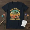 Stop the Car I See A Rock t-shirt design with a T-Rex in a jeep and vintage sunset background