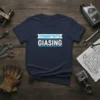 Straight Outta Giasing text design on a navy blue t-shirt, surrounded by tools and engine parts