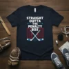 Straight Outta The Penalty Box text with hockey sticks and puck graphic on a navy t-shirt