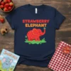 Navy t-shirt with "Strawberry Elephant" text above a red elephant graphic with strawberry spots