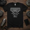 Black t-shirt with "STRENGTH" text above a graphic of a powerful fist and lightning bolts