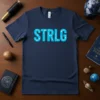 Navy blue t-shirt featuring the word STRGL in bright blue letters, each letter formed by a constellation graphic
