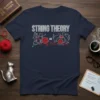Navy t-shirt with "String Theory Cats" design, showing cats playing with yarn and mathematical equations