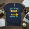 Navy t-shirt with "STUCK BETWEEN WORING & WORKING & PAYING BILL" text and yellow arrows, featuring a lock symbol