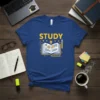 Blue t-shirt with the word "STUDY" in yellow, featuring an open book with lightbulbs and pencils illustration, representing education and