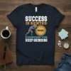 T-shirt with text "Success Is Rented Everyday For Keep Grinding" and a graphic of a man pushing a boulder labeled