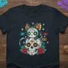Sugar Skull Cat T-Shirt featuring a black cat with Dia de los Muertos face paint sitting on a decorated sugar