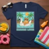 Summer Lover t-shirt with cartoon cat wearing sunglasses on a swan float in a pool, surrounded by palm trees