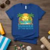 Summer At The Beach T-Shirt with flamingo, heart sunglasses, palm trees, and ocean graphic