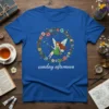 Sunday afternoon t-shirt with a whimsical fairy swinging in a floral wreath graphic