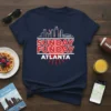Navy t-shirt with "SUNDAY FUNDAY ATLANTA" in bold red and white text, overlaid on a white skyline graphic