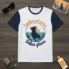 Sunkissed nose Feline glows text and silhouette of a cat sitting by the ocean on a white and navy raglan