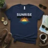 Navy blue t-shirt with white "SUNRISE" text above a graphic of a sun rising over stylized blue waves