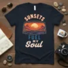 Sunsets Fuel My Soul t-shirt featuring a desert sunset view from a car window, with mountains and cacti, in a