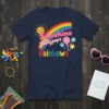 Sunshine Lollypops Rainbows text with a smiling sun and colorful lollipops and rainbow on a navy blue t-shirt